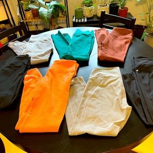 7 pairs of lightly worn, some never worn, fabletics leggings.  Size MED.